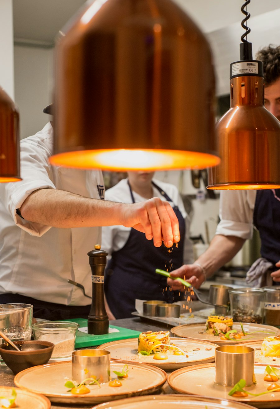 Warm restaurant kitchen under hanging lamps