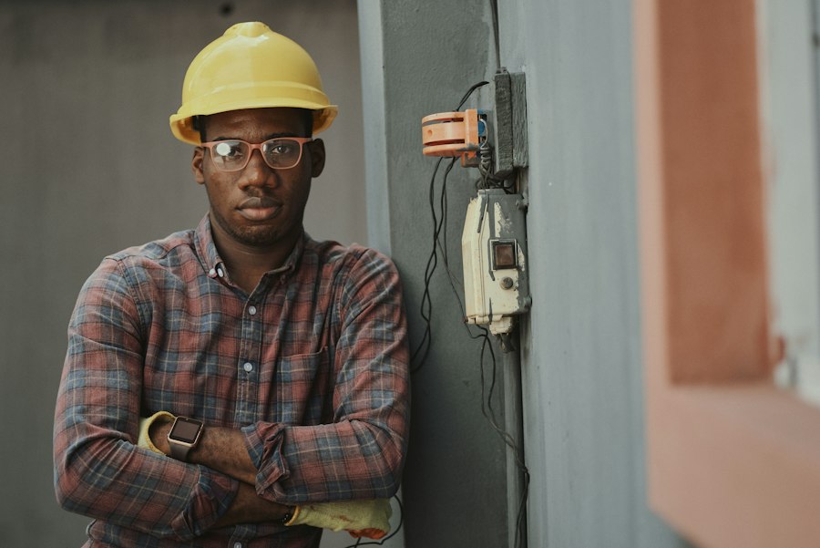 A contractor in a hard hat on a job site